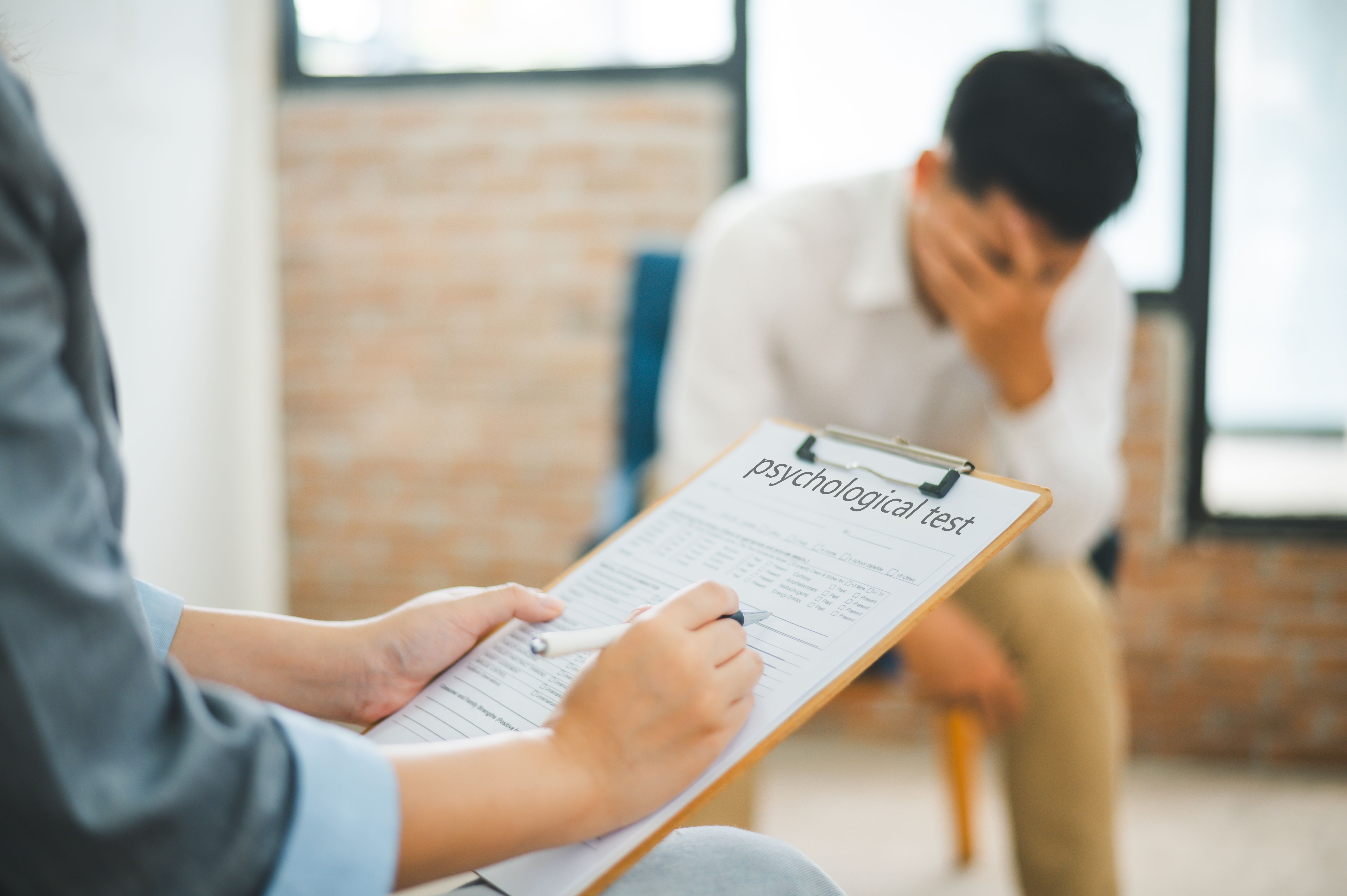 Board-certified psychiatrist meeting with patient during evaluation appointment